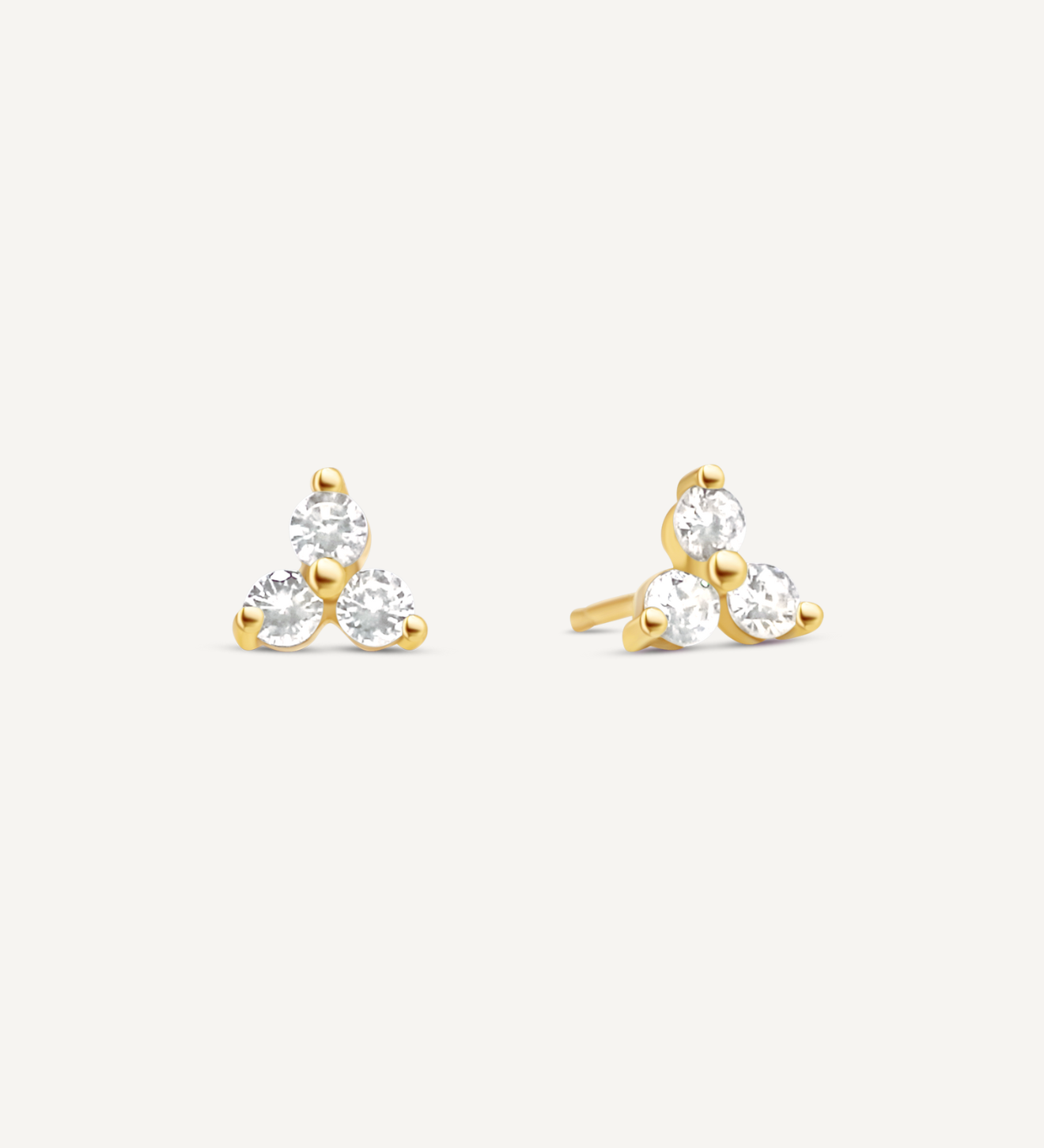 Stud earrings with three circle shaped clear Cubic Zirconia stones in the form of a triangle set into 18K Gold Filled.